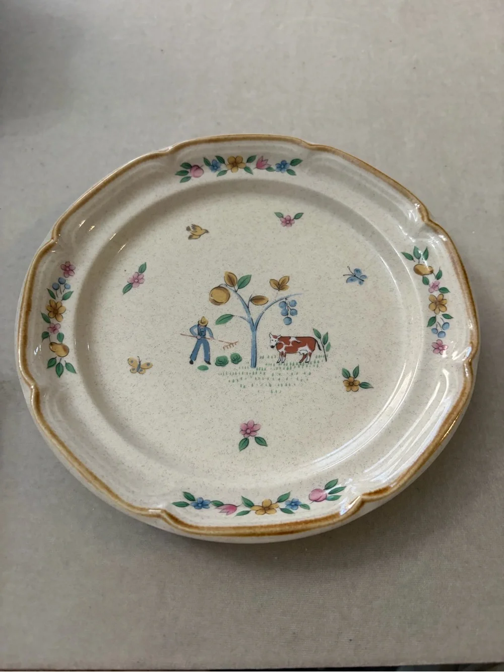 International Cream Ceramic Cup and Saucer Set with Hand-Painted Village Design